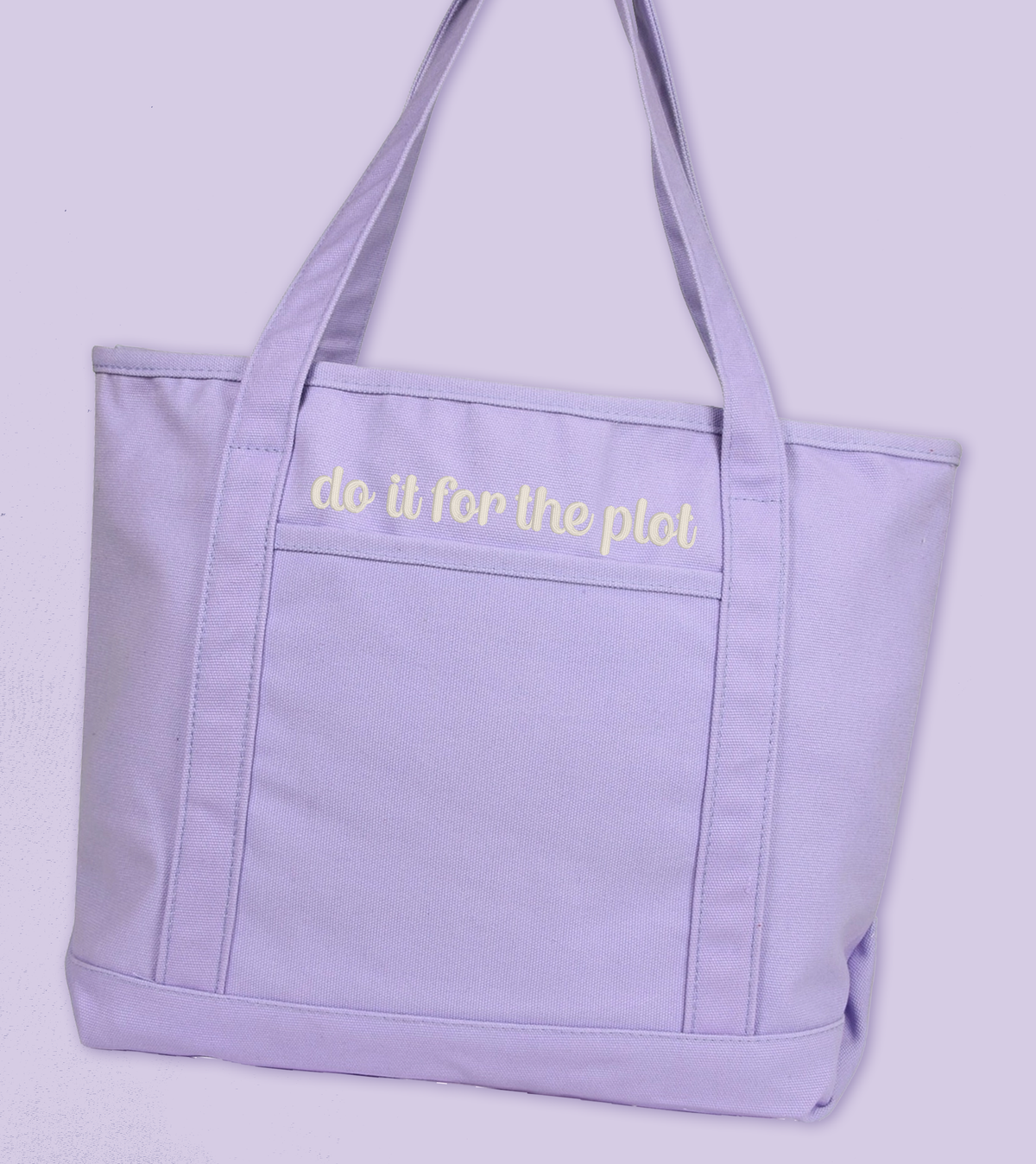 A light purple canvas tote bag with white embroidered text reading 'do it for the plot' on the front pocket, shown against a matching light purple background.